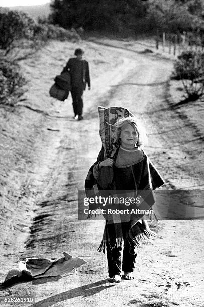 Young child walks on Coleman Valley Road heading towards Wheelers Ranch on March 25, 1970 in Occidental, California.