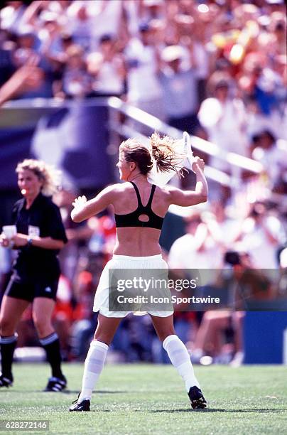 Brandi Chastain of the USA celebrates after she scores the winning goal to defeat China in the World Cup Finals at the Rose Bowl in Pasadena, CA.