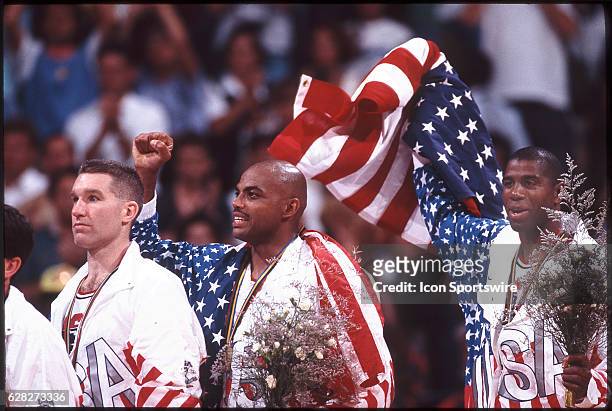 Chris Mullin , Charles Barkley and Magic Johnson of Team USA, the Dream Team, on the victor's podium after winning the gold medal in the men's...