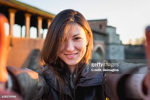 young woman embracing - pavia italy stock pictures, royalty-free photos & images