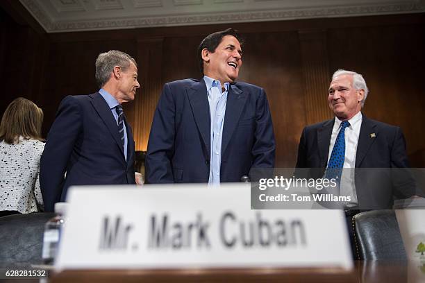 From left, Jeffrey Bewkes CEO of Time Warner, Mark Cuban, Chairman of AXS TV, and Gene Kimmelman, CEO of Public Knowledge, prepare to testify during...