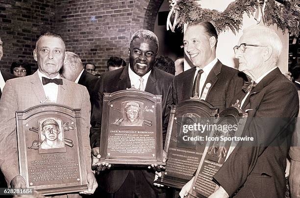 To R - Edd J. Roush of the Cincinnati Reds, Jackie Robinson of the Brooklyn Dodgers, Bob Feller of the Cleveland Indians and Bill McKechnie who...