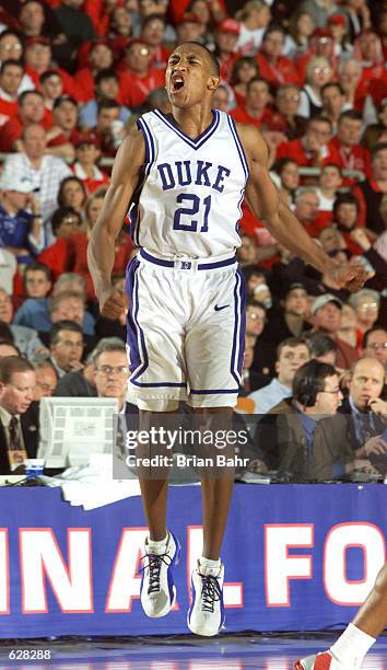 Chris Duhon of Duke celebrates during the semifinal of the Men's NCAA Basketball Final Four tournament against Maryland at the Metrodome in...