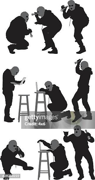 robber in various actions - hacker hoodie stock illustrations