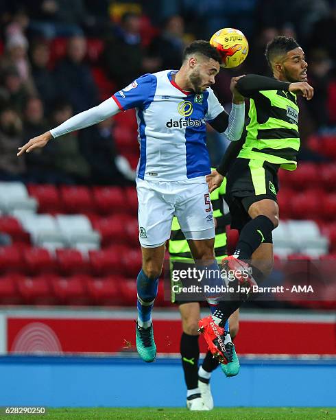 Derrick Williams of Blackburn Rovers wins a header against Elias Kachunga of Huddersfield Town during the Sky Bet Championship match between...