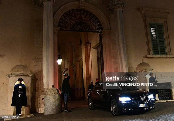 Italy's Prime Minister Matteo Renzi leaves by car the Quirinale Presidential Palace on December 7, 2016 in Rome, after presenting his official...