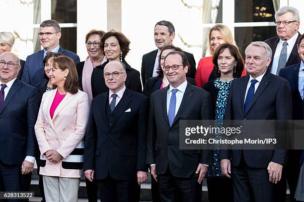 French President Francois Hollande and his ministers including new Frence Prime Minister Bernard Cazeneuve pose for a family portrait, one day after...