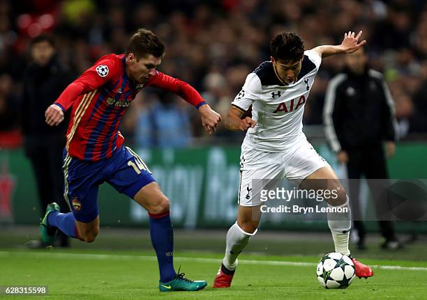 Kirill Nababkin of CSKA Moscow and Heung-Min Son of Tottenham Hotspur battle for possession during the UEFA Champions League Group E match between...