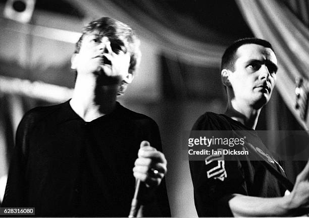 Mark E Smith and guitarist Martin Bramah of The Fall performing on stage at Kilburn National, London, 21 March 1990.