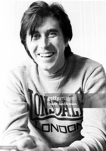 Bryan Ferry, at home wearing a Lonsdale sweatshirt, at the time of his first solo album 'These Foolish Things', London, 1973.