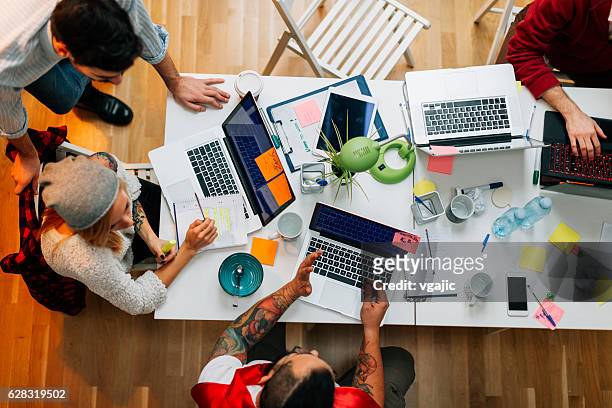 developers working in their office. - creative occupation stock pictures, royalty-free photos & images