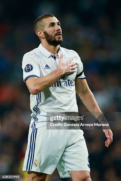 Karim Benzema of Real Madrid celebrates scoring his sides first goal during the UEFA Champions League Group F match between Real Madrid CF and...