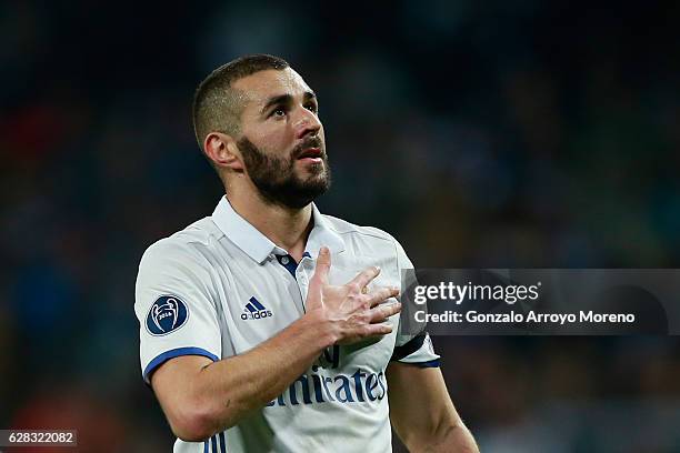 Karim Benzema of Real Madrid celebrates scoring his sides first goal during the UEFA Champions League Group F match between Real Madrid CF and...