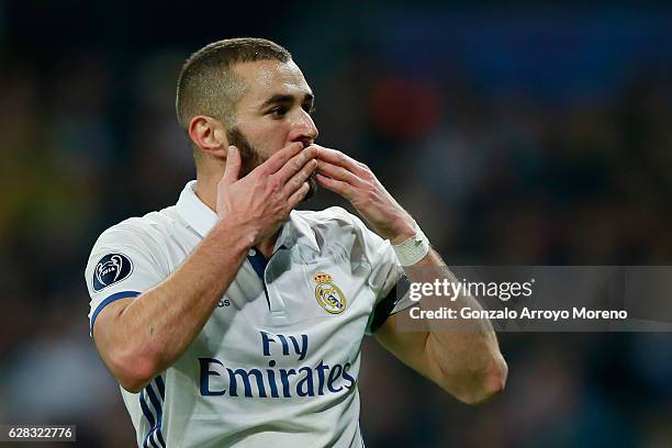 Karim Benzema of Real Madrid celebrates scoring his sides first goal during the UEFA Champions League Group F match between Real Madrid CF and...