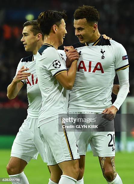 Tottenham Hotspur's English midfielder Dele Alli celebrates with Tottenham Hotspur's South Korean striker Son Heung-Min and Tottenham Hotspur's...