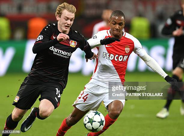 Leverkusen's midfielder Julian Brandt and Monaco's Abdou Diallo vie for the ball during the UEFA Champions League group E football match between...