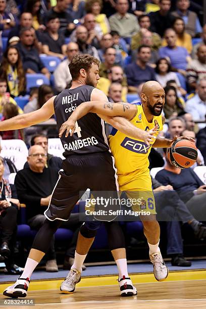 Devin Smith, #6 of Maccabi Fox Tel Aviv competes with Nicolo Melli, #4 of Brose Bamberg during the 2016/2017 Turkish Airlines EuroLeague Regular...