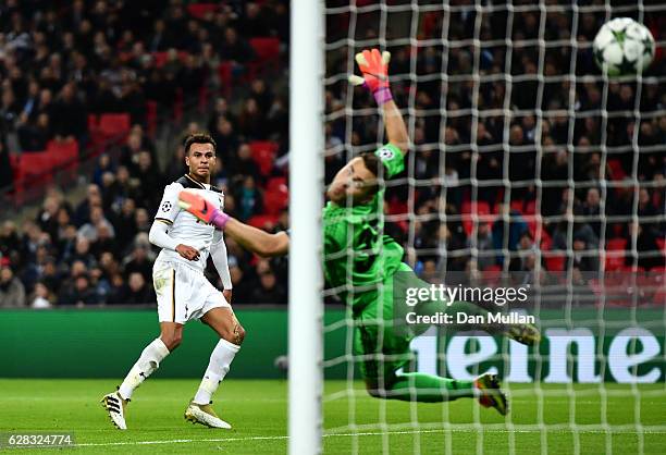 Dele Alli of Tottenham Hotspur scores his sides first goal past Igor Akinfeev of CSKA Moscow during the UEFA Champions League Group E match between...
