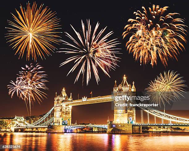 new year celebration over the tower bridge for 2016 - city of london stock pictures, royalty-free photos & images
