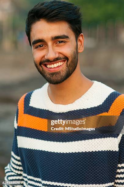 handsome smiling man looking at camera. - handsome indian guys stock pictures, royalty-free photos & images