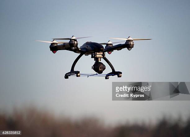europe, germany, view of drone with camera flying, airborne - helicopter rotors stock-fotos und bilder