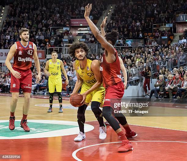 Devin Booker of Bayern Muenchen und Asssem Marei of medi bayreuth battle for the ball during the easyCredit BBL match between FC Bayern Muenchen and...