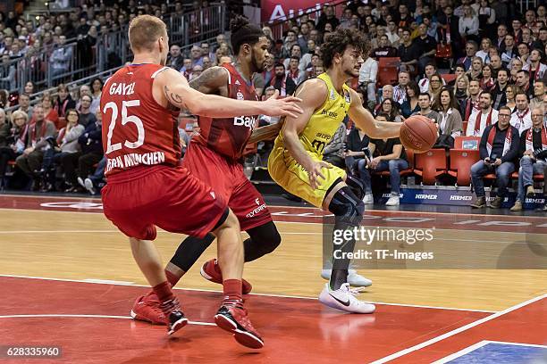 Anton Gavel of Bayern Muenchen , Devin Booker of Bayern Muenchen und Asssem Marei of medi bayreuth battle for the ball during the easyCredit BBL...