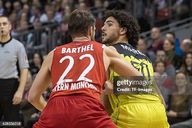 Danilo Barthel of Bayern Muenchen und Asssem Marei of medi bayreuth battle for the ball during the easyCredit BBL match between FC Bayern Muenchen...