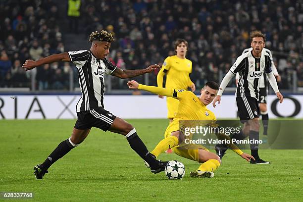 Mario Lemina of Juventus is tackled by Amer Gojak of GNK Dinamo Zagreb during the UEFA Champions League Group H match between Juventus and GNK Dinamo...