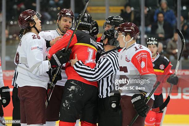 Players tangle during the Champions Hockey League Quarter Final match between SC Bern and Sparta Prague at Postfinance Arena on December 13, 2016 in...
