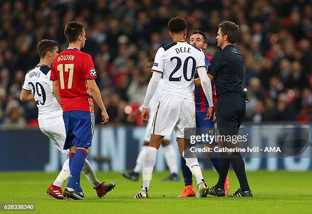 Dele Alli of Tottenham Hotspur clashes with Zoran Tosic of CSKA Moscow during the UEFA Champions League match between Tottenham Hotspur FC and PFC...