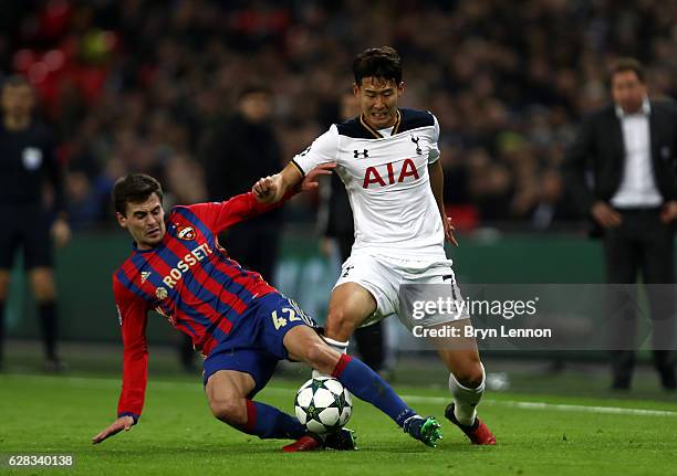 Georgi Schennikov of CSKA Moscow tackles Heung-Min Son of Tottenham Hotspur during the UEFA Champions League Group E match between Tottenham Hotspur...