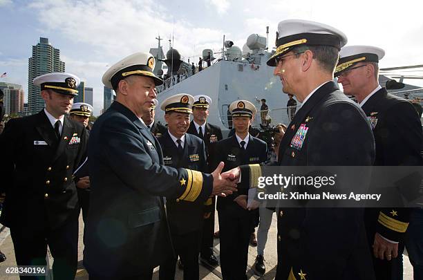 Dec. 7, 2016 -- Chinese fleet commander Rear Admiral Huang Xinjian meets with Commander of the United States Carrier Strike Group Nine RDML Bynum in...