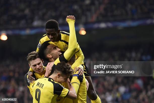 Dortmund players celebrate their second goal during the UEFA Champions League football match Real Madrid CF vs Borussia Dortmund at the Santiago...