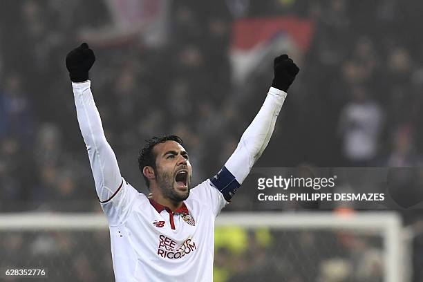 Sevilla's midfielder Vicente Iborra celebrates at the end of the UEFA Champions League Group H football match between Olympique Lyonnais and FC...