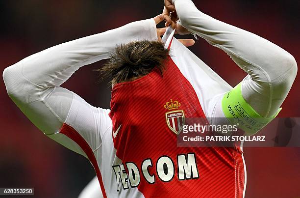 Monaco's Moroccan midfielder Nabil Dirar pulls off his shirt after the UEFA Champions League group E match between Bayer 04 Leverkusen and AS Monaco...