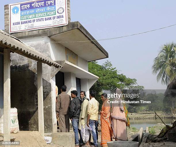 Villagers waiting in the queue at the customer service point of SBI, Laxbagan, Satjelia island on December 5, 2016 Sunderban, India. Since...