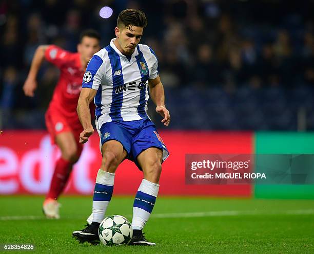 Porto's midfielder Andre Silva shoots a penalty kick to score his team's fourth goal during the UEFA Champions League football match FC Porto vs...