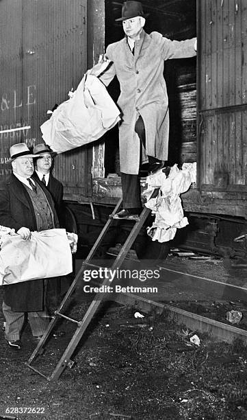 Police officers remove dismembered body from a box car in which it was found in Pittsburgh. In all, three headless bodies, two of them in sections,...