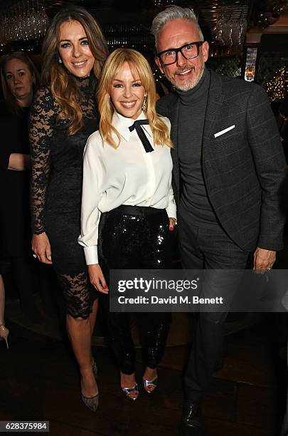 Elizabeth Hurley, Kylie Minogue and Patrick Cox attend an intimate performance with Kylie Minogue at The Ivy to kick off The Ivy 100 Centenary...