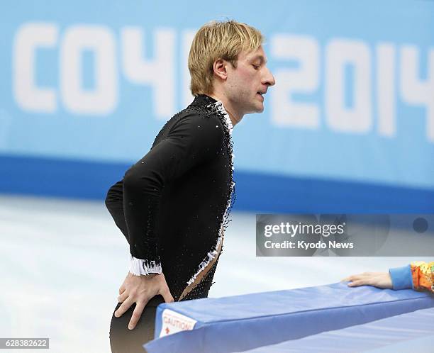 Russia - Evgeni Plushenko of Russia leaves the rink after withdrawing from the men's short program figure skating competition due to an injury during...