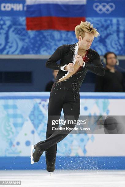 Russia - Russian figure skater Evgeni Plushenko jumps during a six-minute official practice session at the Iceberg Skating Palace in Sochi, Russia,...