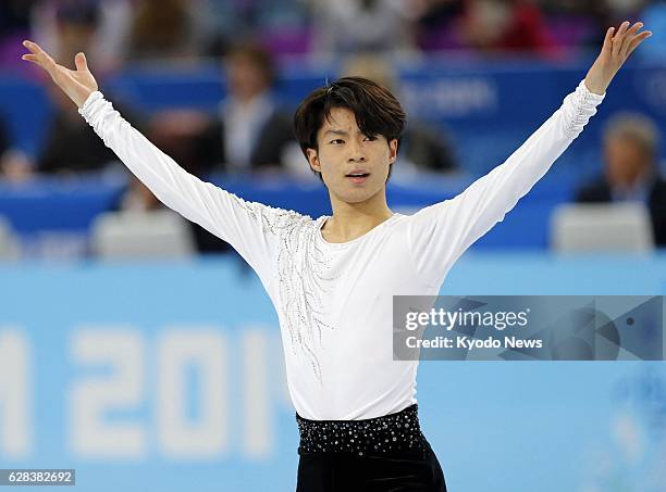 Russia - Tastuki Machida of Japan responds to the crowd after his performance in the men's figure skating short program at the Iceberg Skating Palace...