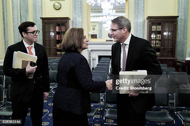 Chris Spear, president and chief executive officer of the American Trucking Associations , right, shakes hands with Senator Deb Fischer, a Republican...