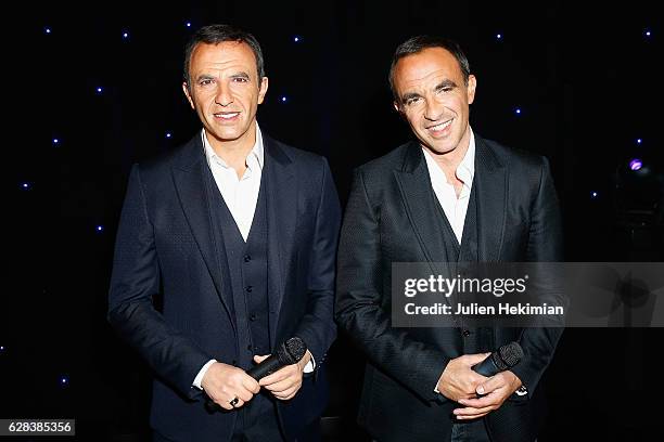 French TV Presenter Nikos Aliagas is pictured with his wax statue during his Wax Work Unveiling celebration at Musee Grevin In Paris at Musee Grevin...