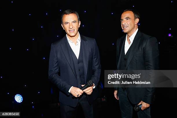 French TV Presenter Nikos Aliagas is pictured with his wax statue during his Wax Work Unveiling celebration at Musee Grevin In Paris at Musee Grevin...