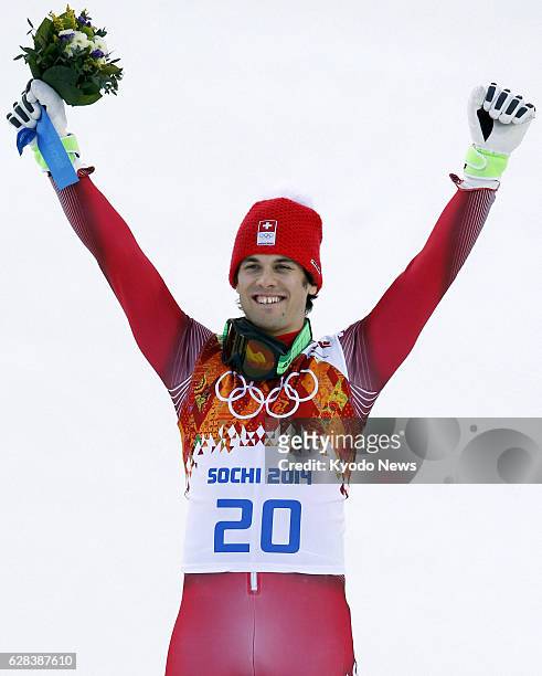 Russia - Sandro Viletta of Switzerland celebrates after winning the gold medal in the men's super combined ski race at the Rosa Khutor Alpine Center...