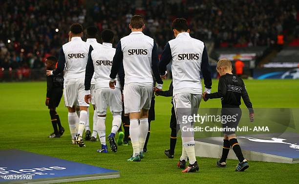 The Tottenham Hotspur team walk out wearing Spurs warm up jackets before the UEFA Champions League match between Tottenham Hotspur FC and PFC CSKA...