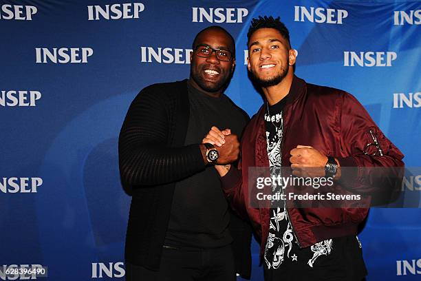 Olympic medalists judoka Teddy Riner and boxer Tony Yoka pose at the 9th annual Champions Soiree held at INSEP on December 7, 2016 in Paris, France....