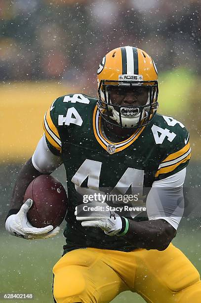 James Starks of the Green Bay Packers runs for yards during a game against the Houston Texans at Lambeau Field on December 4, 2016 in Green Bay,...